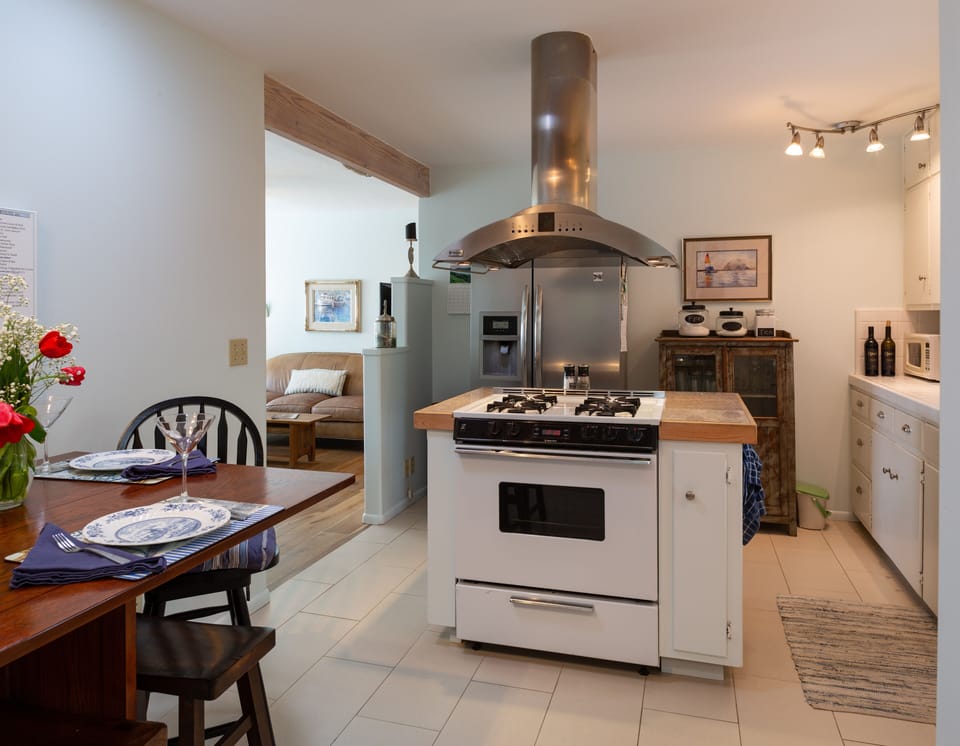A view from kitchen to living room entry where the cook doesn't feel stranded!