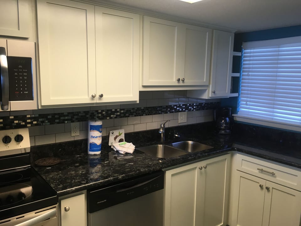 Custom cabinets, granite countertops, tile backsplash, renovated December 2017.