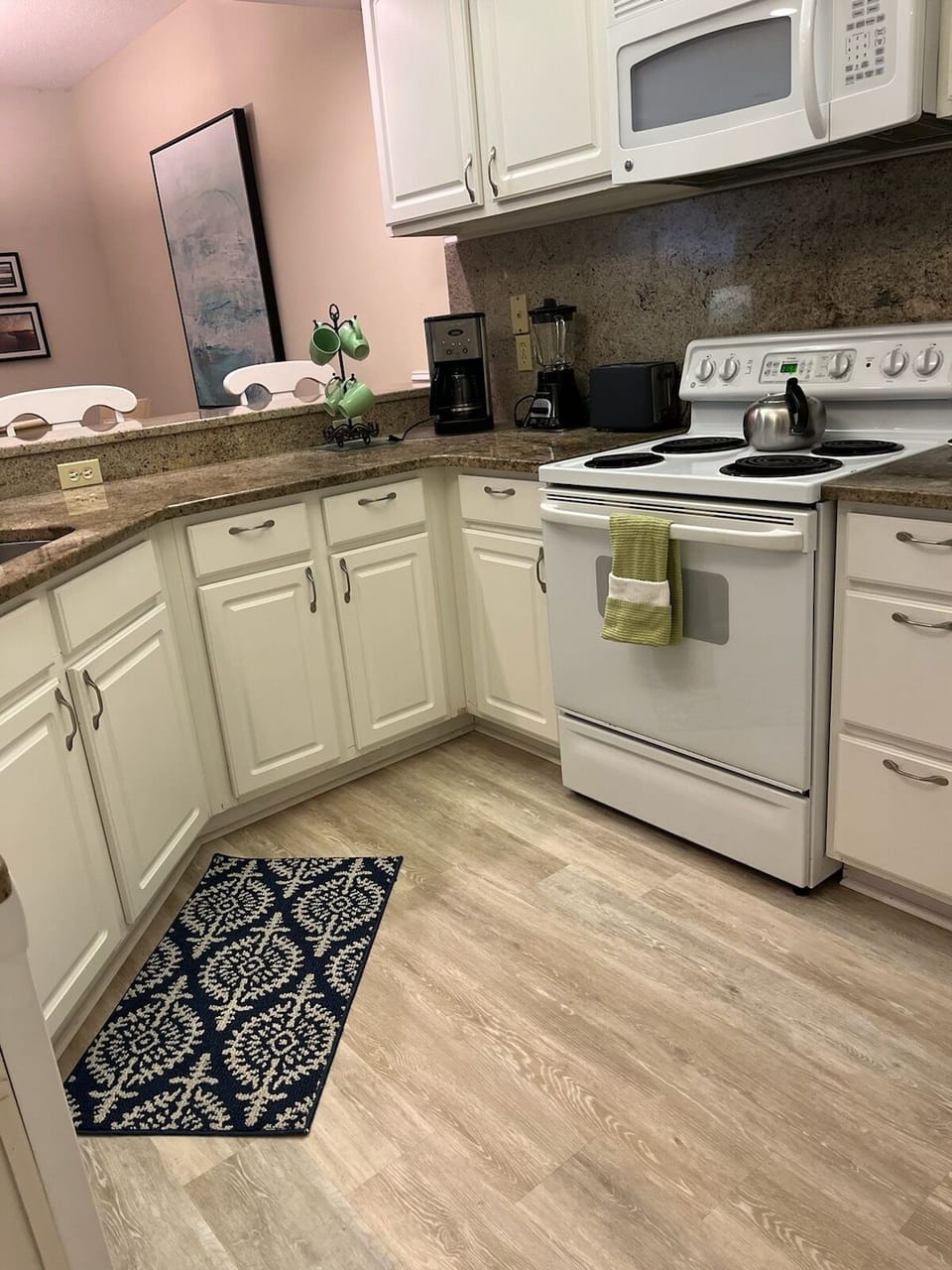 Perfect  food prep triangle open to family seating.  
1-2023 pic, new flooring