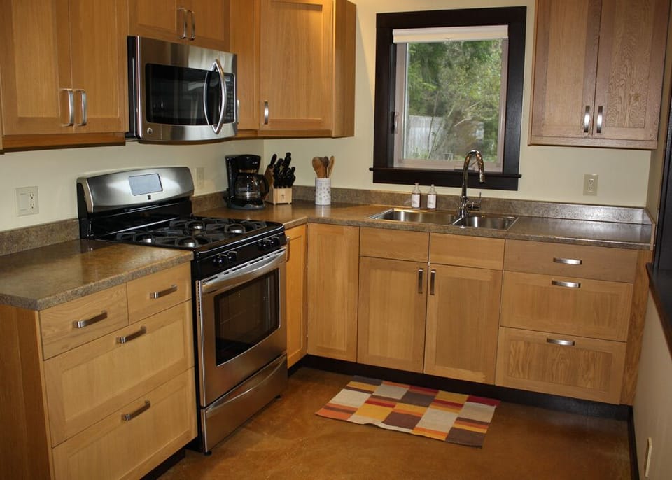 Modern kitchen stocked with everything you need to cook and serve great meals.