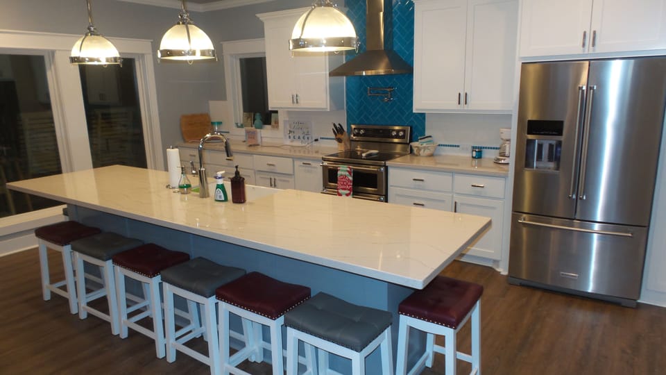 Huge island with a farmhouse sink and seating for 8.