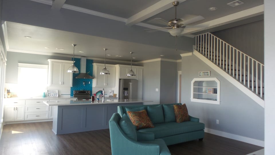 Inviting living room  to gather in for an evening of board games or tv watching.