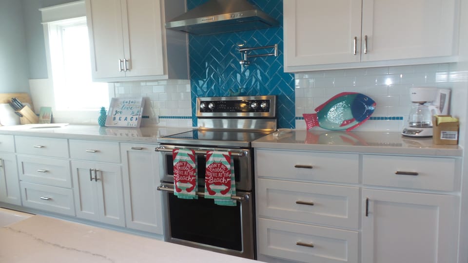 Bright and beautiful kitchen is a great gathering space for snacks and meals.