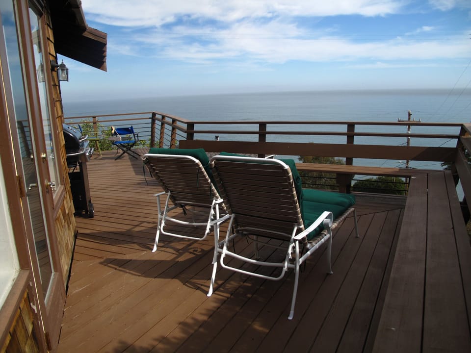 Large private deck with outdoor furniture and new gas grill