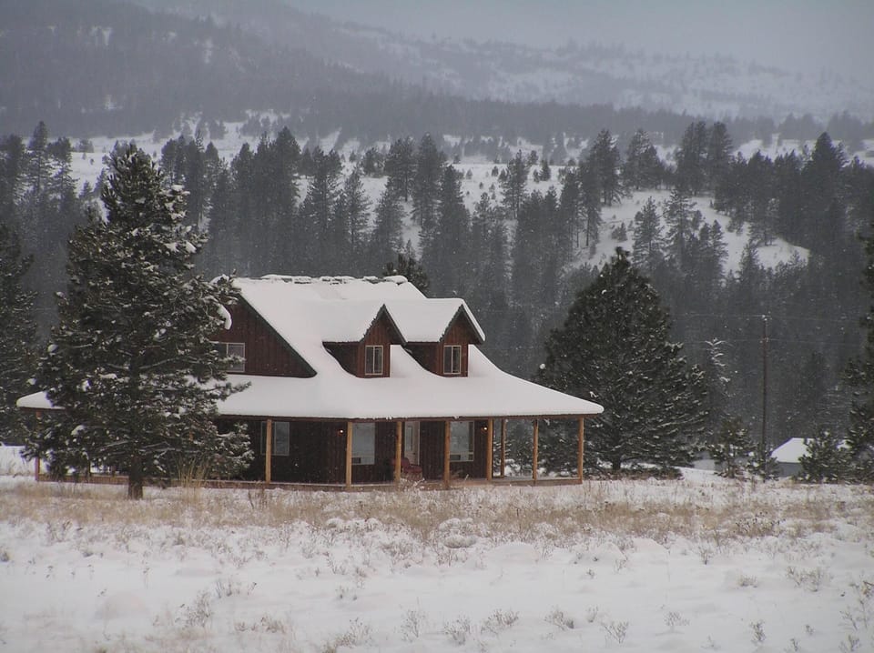 The cabin in winter. Snowshoes/sleds in the garage - small hill on the property.