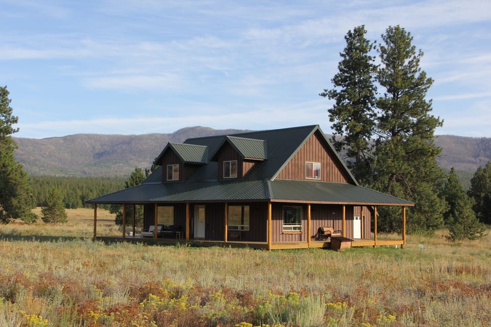 A frontier feel, a view from every window, and a wrap around deck.