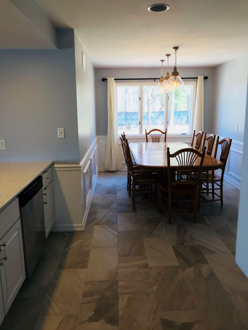 Table has four leaves and bar has six stools can seat sixteen in the kitchen 