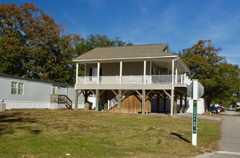 Side view and empty lot that goes with the house