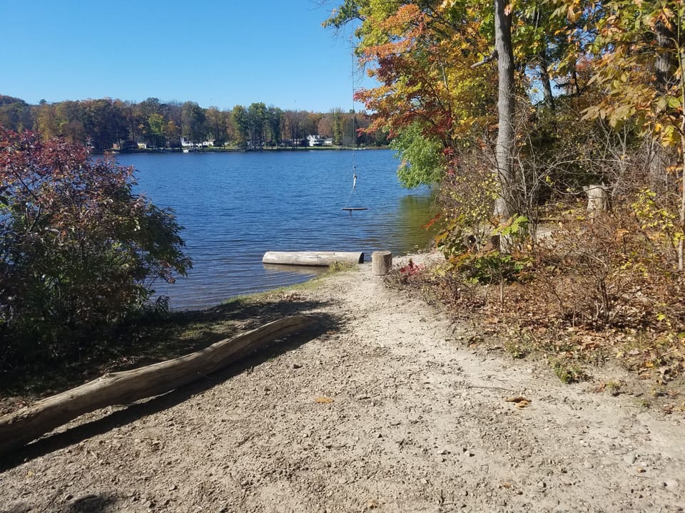Rope swing and pebble swimming area on island, short boat/paddle trip north
