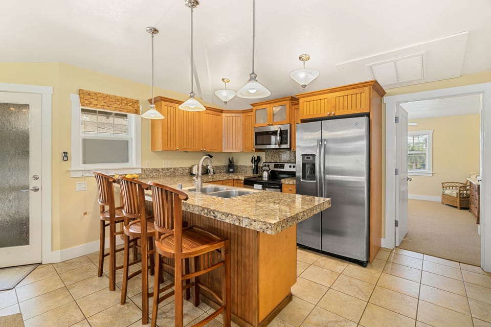 Kitchen with granite counters, stainless steel appliances

