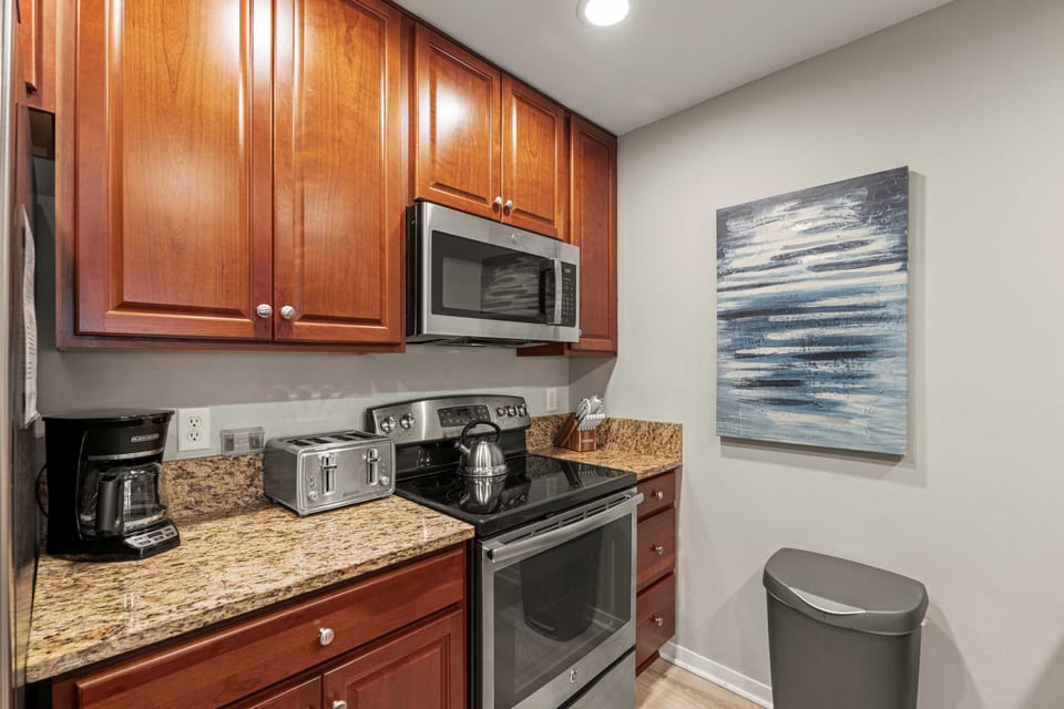 Fully stocked kitchen with stainless steel appliances