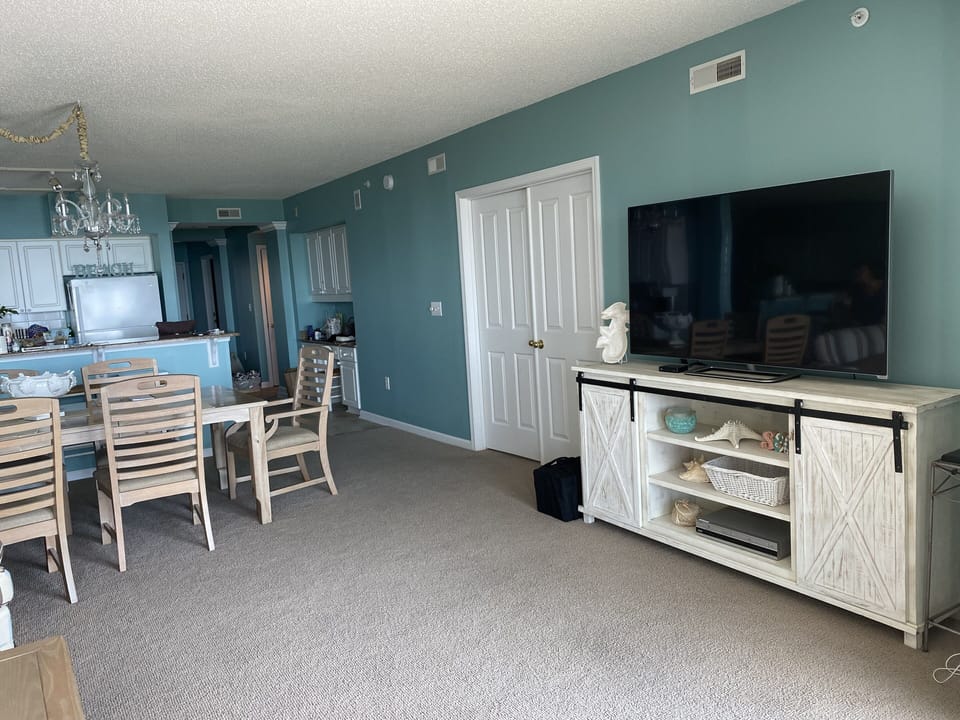 Living area with 65 inch Smart TV.