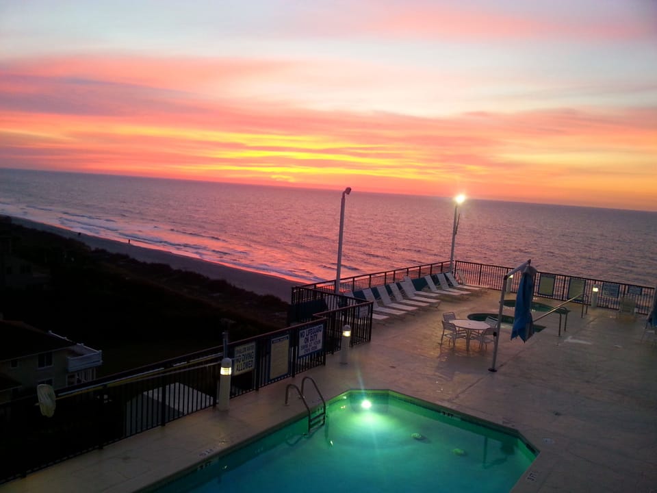 Balcony view from the 2nd bedroom - watch the sun rise over the ocean from bed!