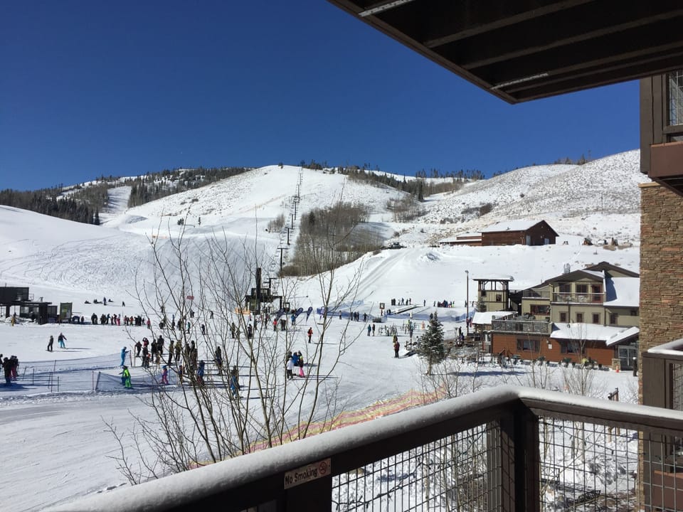 Deck view of base area- 3 lifts,  ski school and lodge
