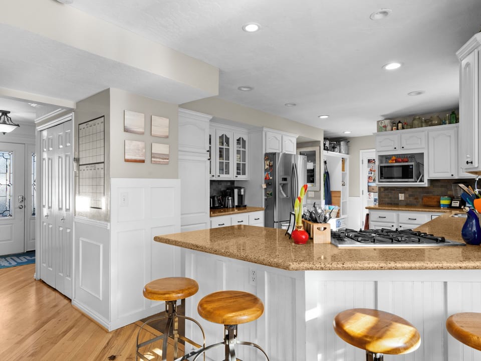 standing in the breakfast nook with a view of the front door 