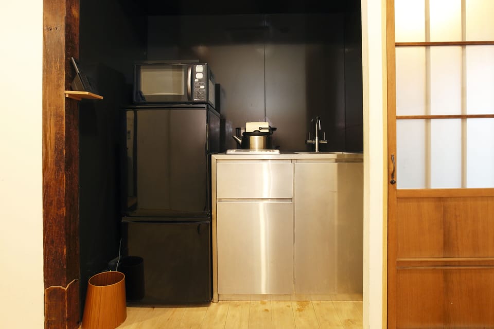 Kitchen with fridge, microwave and Nespresso