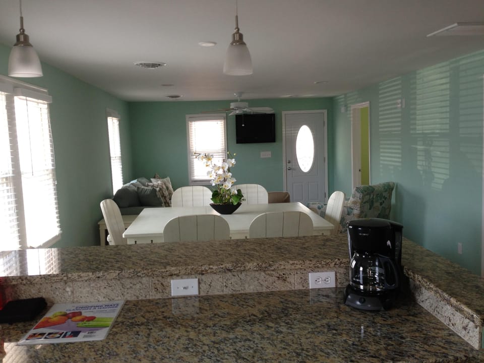 view from the kitchen overlooking the dining room