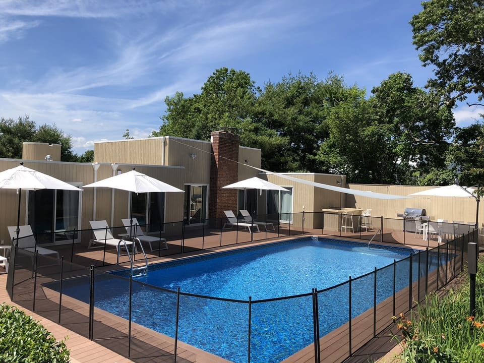 Back deck and pool, bar, dining, lounge area