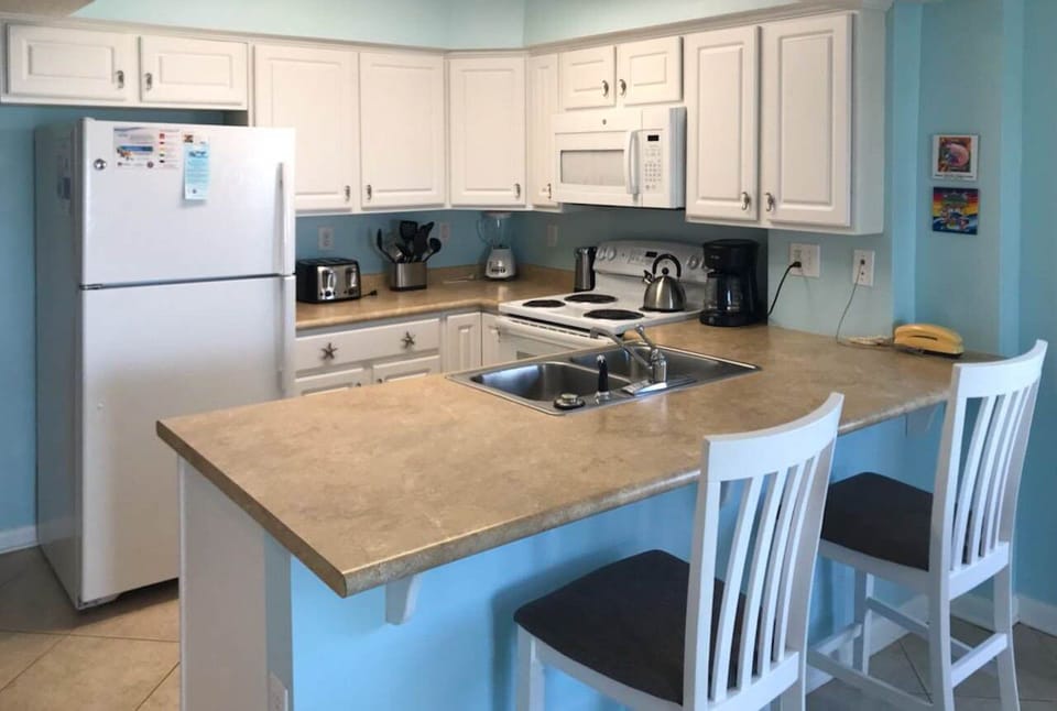 Kitchen with breakfast bar for extra seating at meal time