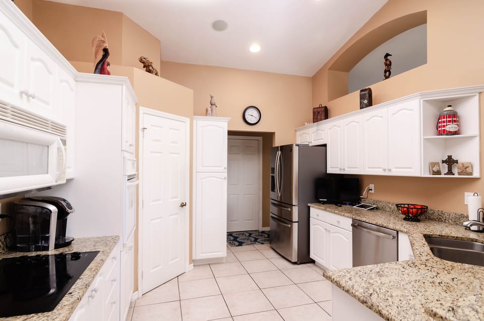 New stainless steel appliances and space for the family to cook together 