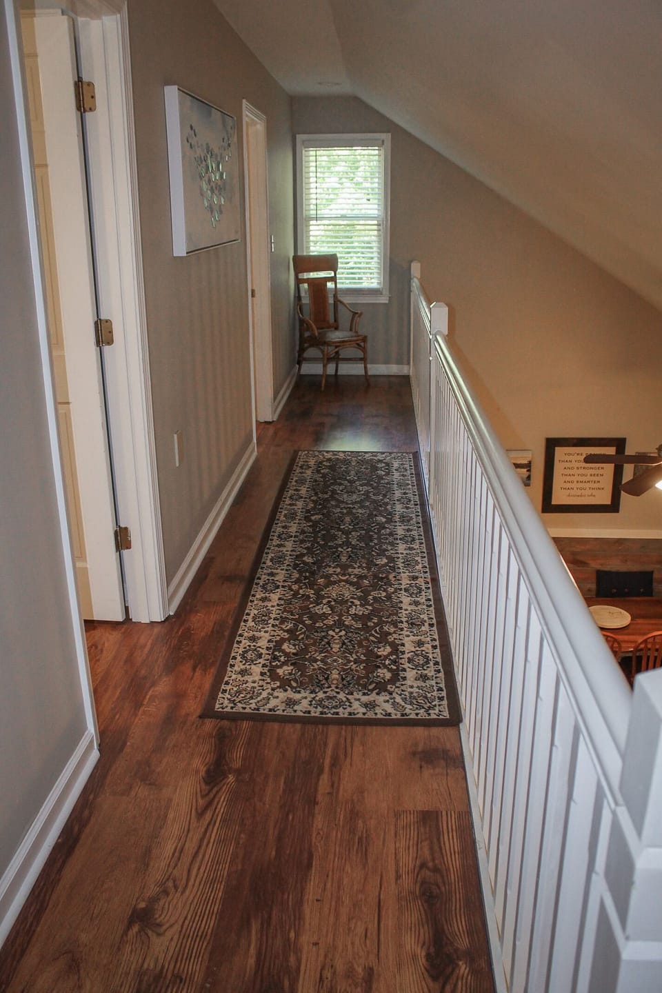 Upstairs balcony overlooking living room & sunroom. Leads to jacknjill bed/bath