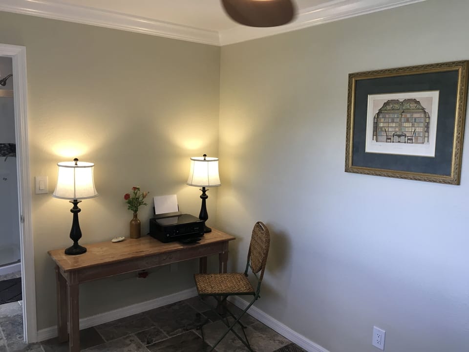 Den with table and chair and wireless printer