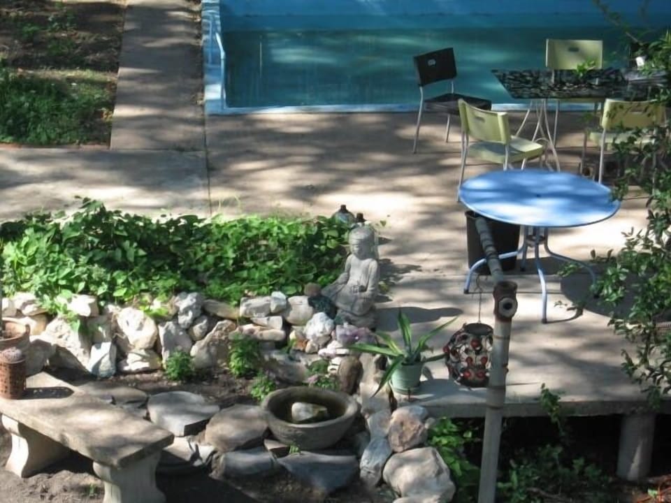 View down to backyard pool patio and sitting area