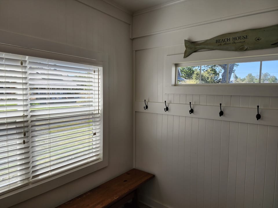 Entry way, with plenty of space for coats and shoes.  And staging luggage.