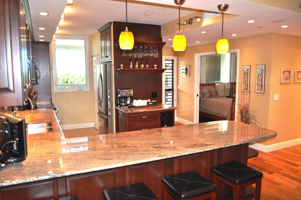 Coffee bar, wine rack, plenty of utensils, cookware, small appliances