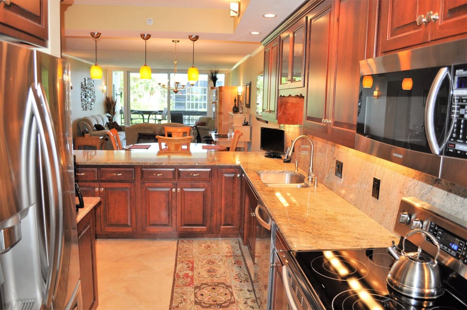 Ample counter space, contemporary lighting, upscale appliances