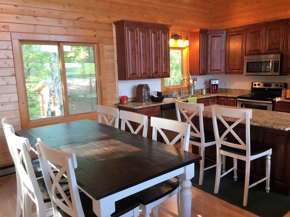 2017 New large "high" kitchen table and chairs.  Can fit 10 comfortably.  