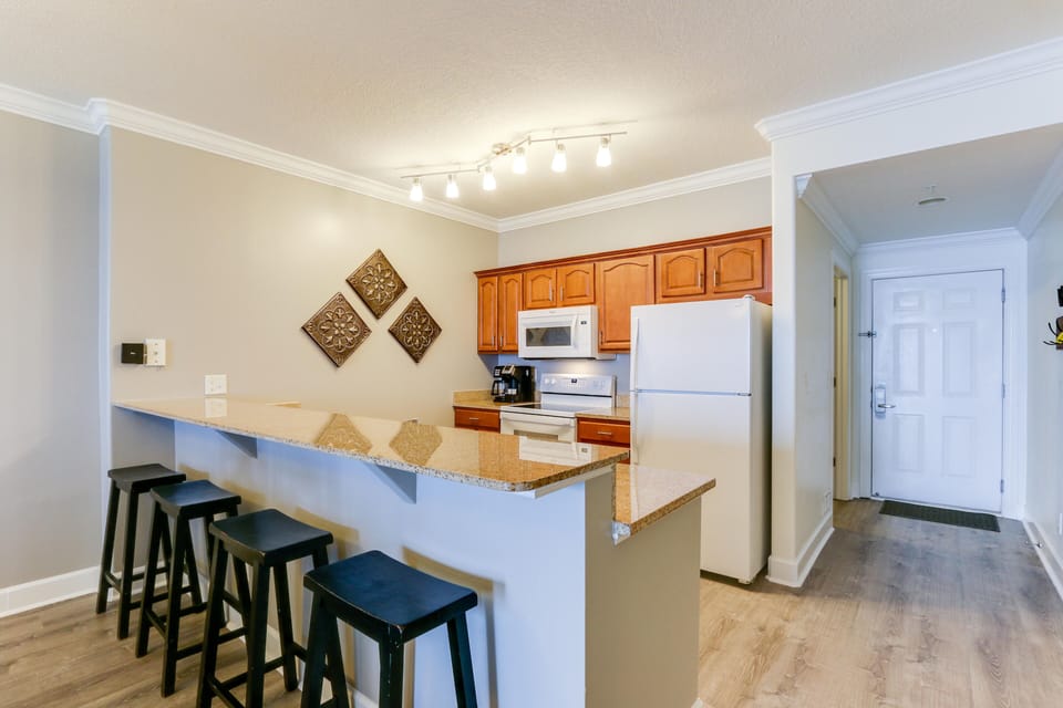 Kitchen is equipped with new utnesils, pots and pans and a dual coffee maker. 