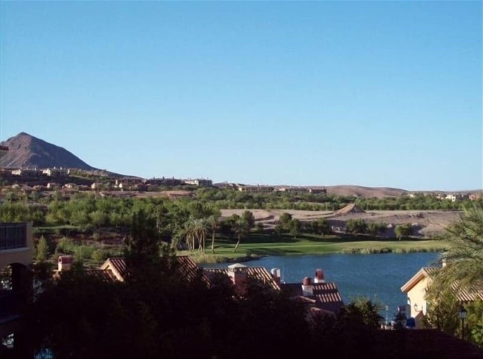 view from condo balcony. Lake, mountain, village, golf course . Not a stock pic.
