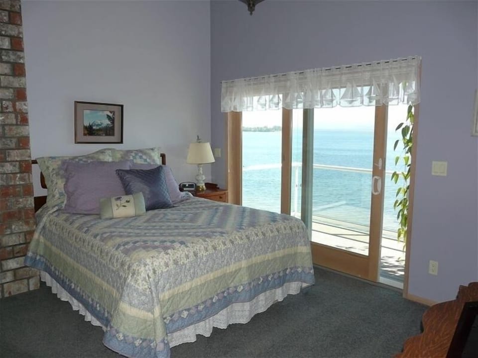 Master bedroom with private balcony and fantastic views