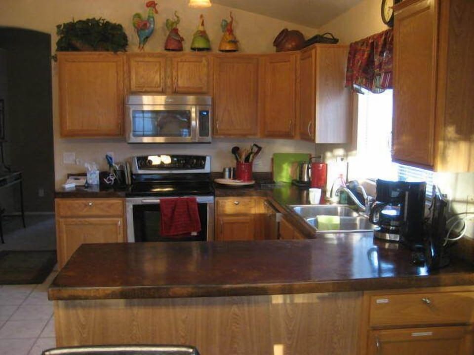 Well equipped kitchen with stainless appliances.