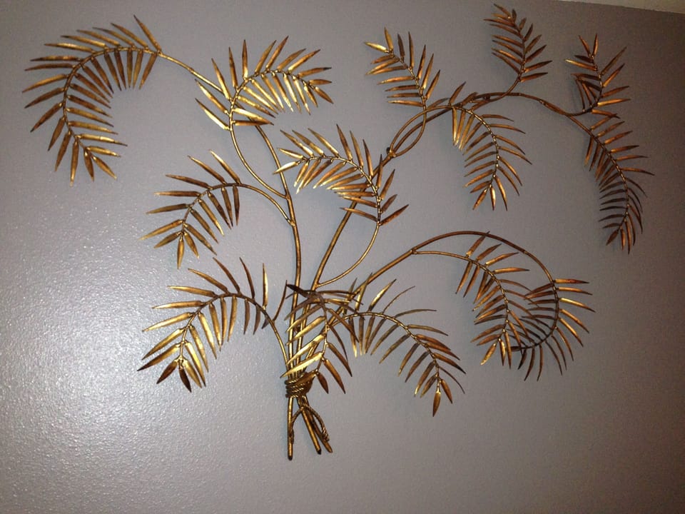 Original 60's metal artwork above bed