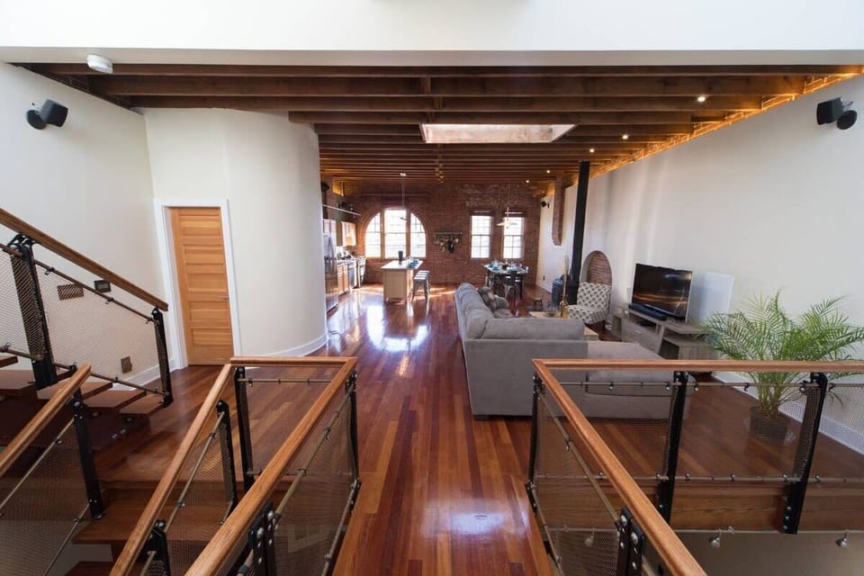 You'll love the vaulted wood beamed ceilings, custom skylight, and exposed brick walls.