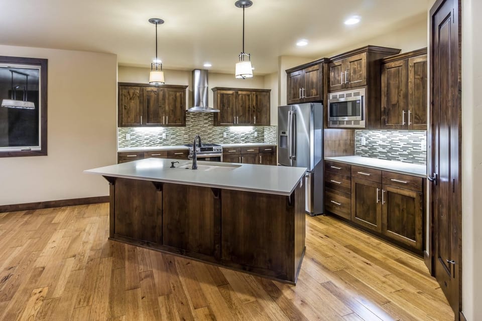 Kitchen area adjacent to living room and dining room.