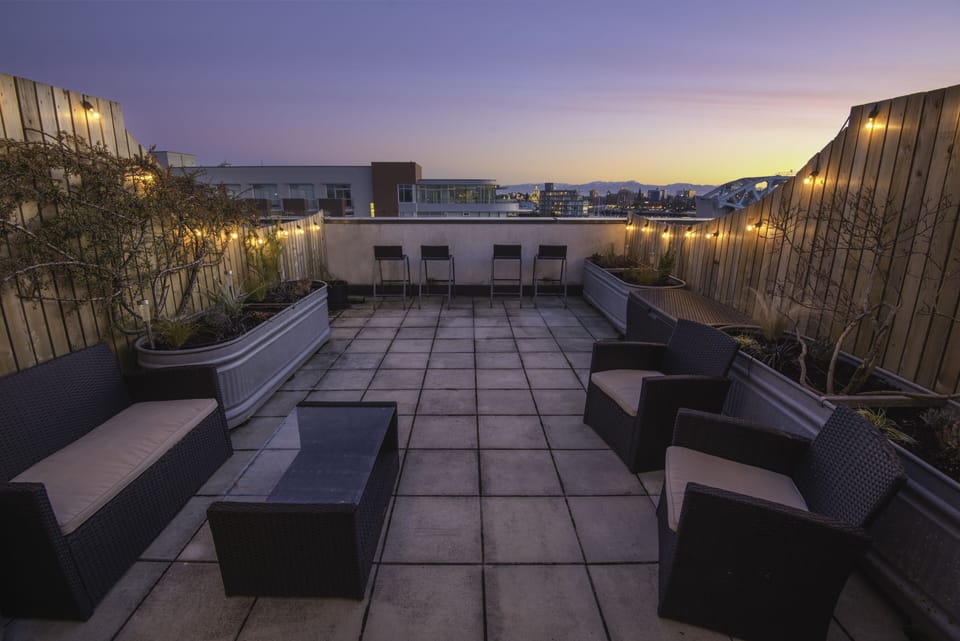 Private rooftop patio. Equipped with lighting, a drink fridge and lots of seats!