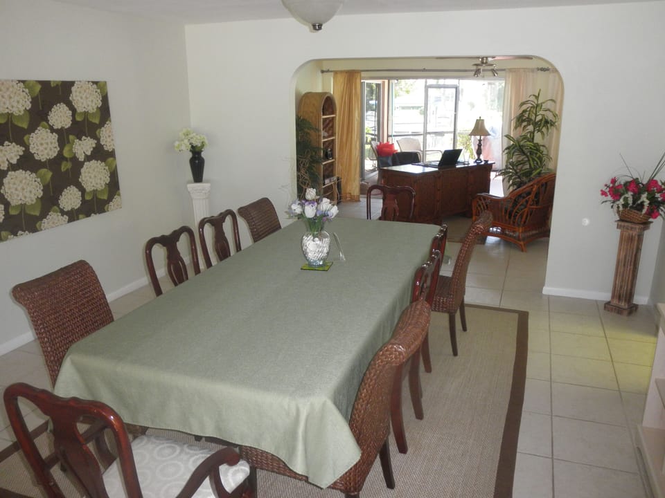 BIG dining room table seats 12. Another table in Sun Room seats 6