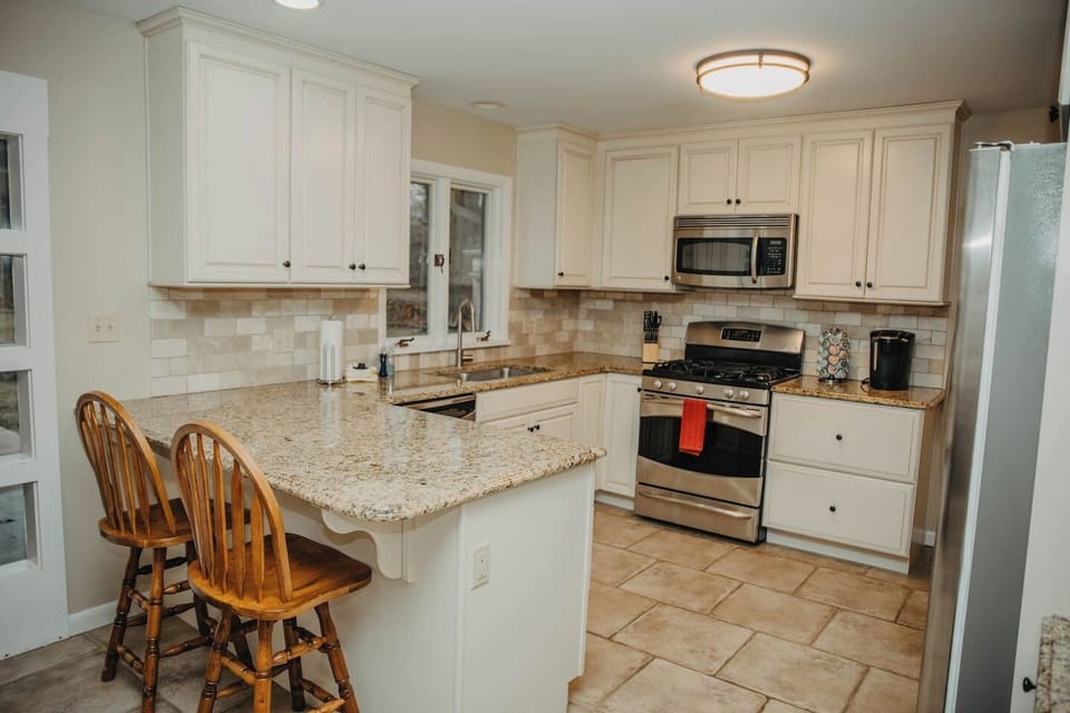 Kitchen shown from opening to Living room
