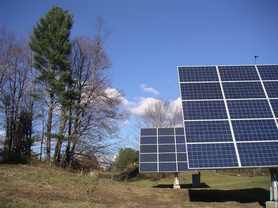 Solar trackers in late Fall 2013 doing their work hill behind the house