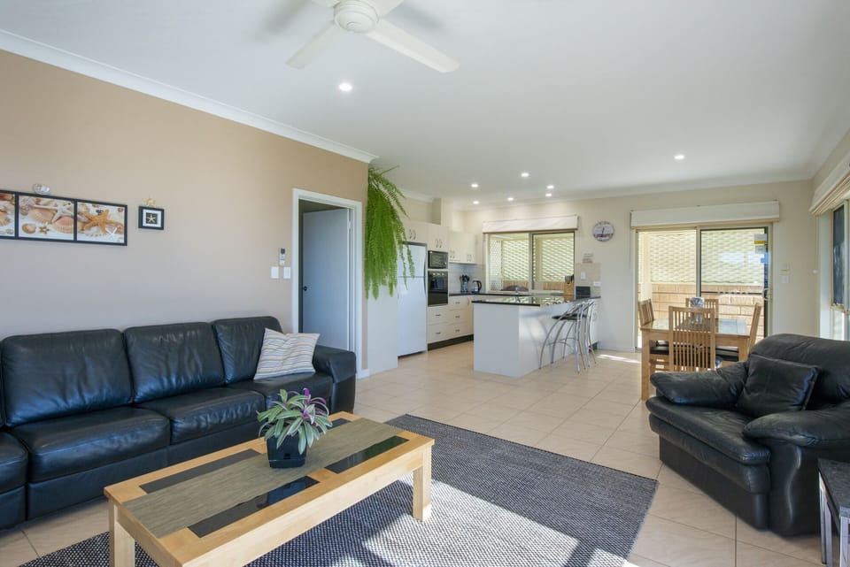 Modern spacious living, dining and kitchen area with full cooking facilities.