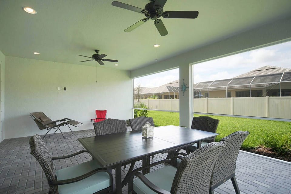 The screened in back porch gives extra room to eat and chill