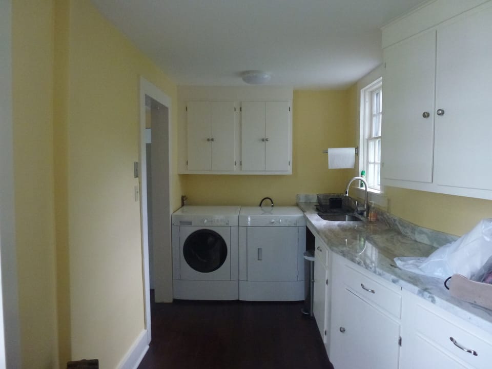Pantry with washer & dryer. The passage from the kitchen to the dining area.