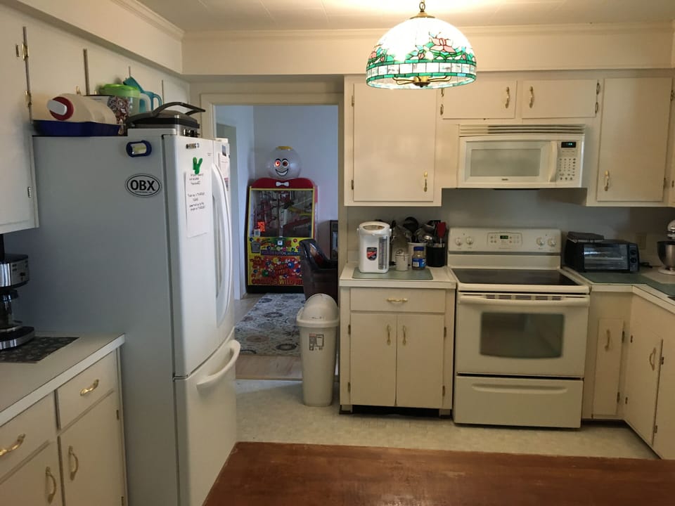 Kitchen, but showing a view to the card room (dining room). 