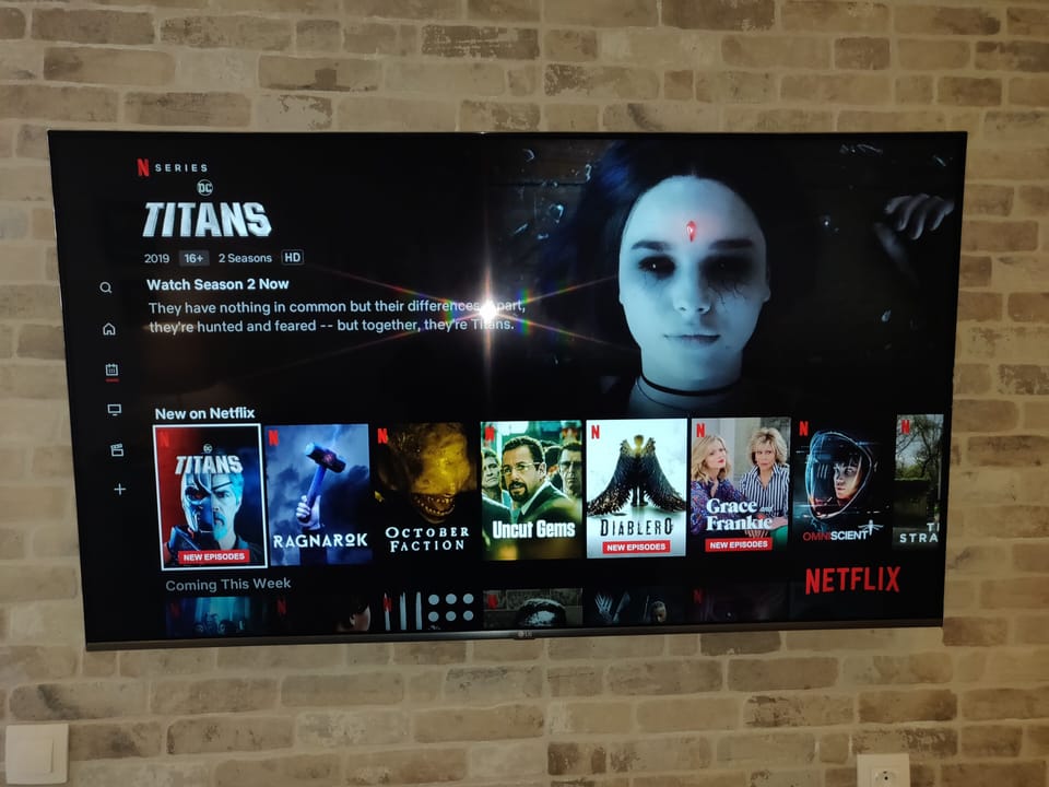 Smart TV in living room with NETFLIX included 