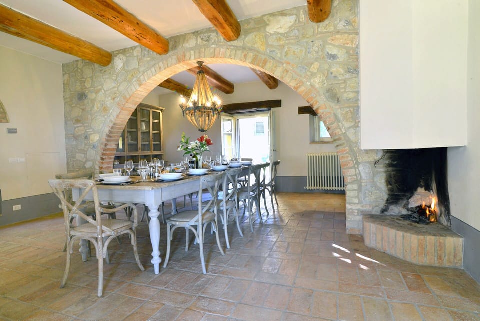 Dining room with fire place and direct acess into the garden