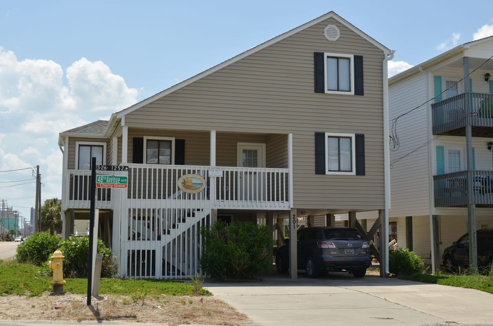 Front of house. Parking for four cars. 