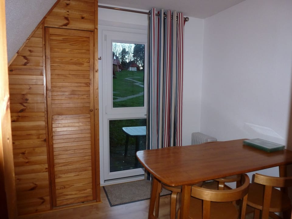 separate dining room with freezer and washing machine, to west facing patio.